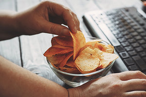 Unhealthy Snacking - Copyright – Stock Photo / Register Mark