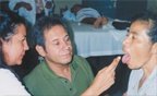 Della Estrada instructs one of the local doctors on tongue diagnosis. - Copyright – Stock Photo / Register Mark