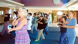 Pamela Brady leads a qigong session from last year's meeting. - Copyright – Stock Photo / Register Mark