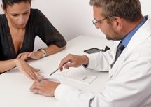 A woman and her doctor discuss her medication. - Copyright – Stock Photo / Register Mark