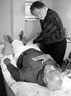 Bob Duggan and other volunteer acupuncturists provide individual full-body treatment. - Copyright – Stock Photo / Register Mark