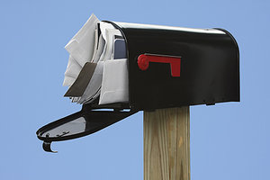 full mailbox - Copyright – Stock Photo / Register Mark