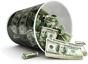 Money in trash can - Copyright – Stock Photo / Register Mark