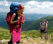 A man and woman backpacking. - Copyright – Stock Photo / Register Mark