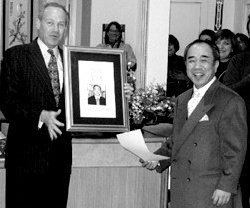 Jack Knight presents an engraved plaque to Emeritus Shuji Goto. - Copyright – Stock Photo / Register Mark